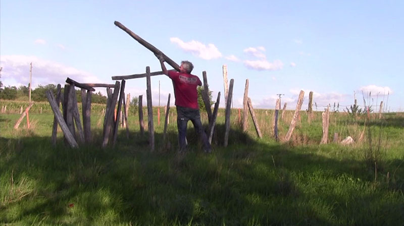 Video still, Lugnez, Jura, Switzerland, Jay Rechsteiner rebuilding Franzueli Rechsteiner's landart sculpture